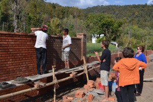 Wall of the school is brick but school will be rammed earth